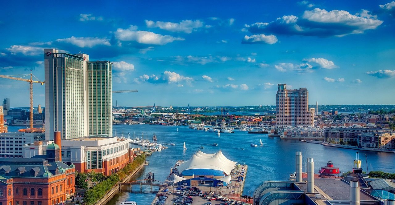 Baltimore harbor with boats, skyline and clouds