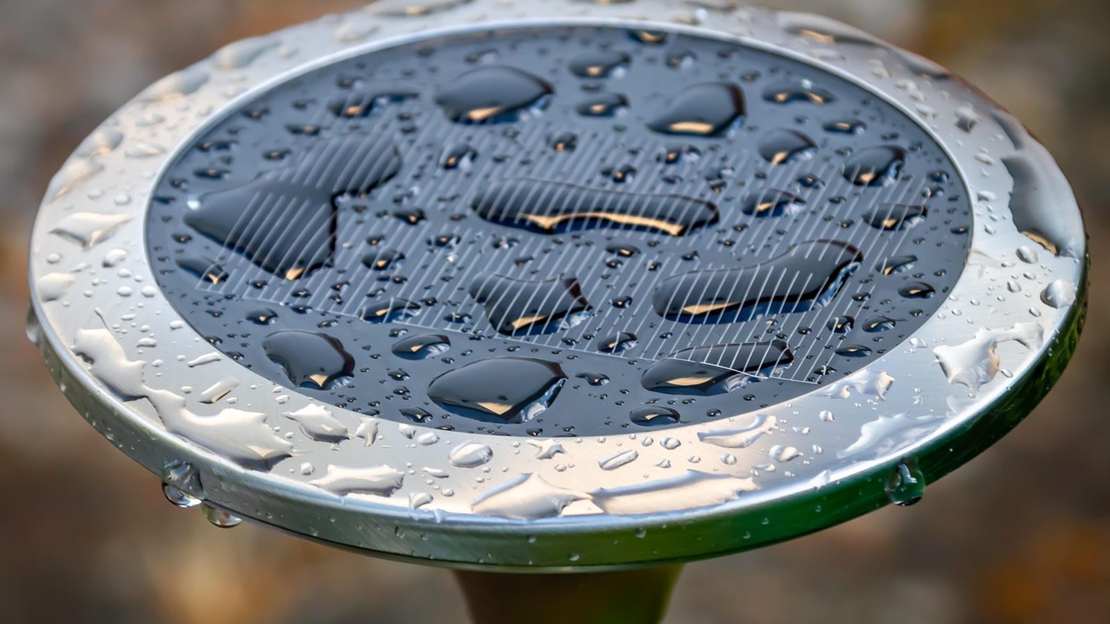 Rain beading on the surface of a solar panel