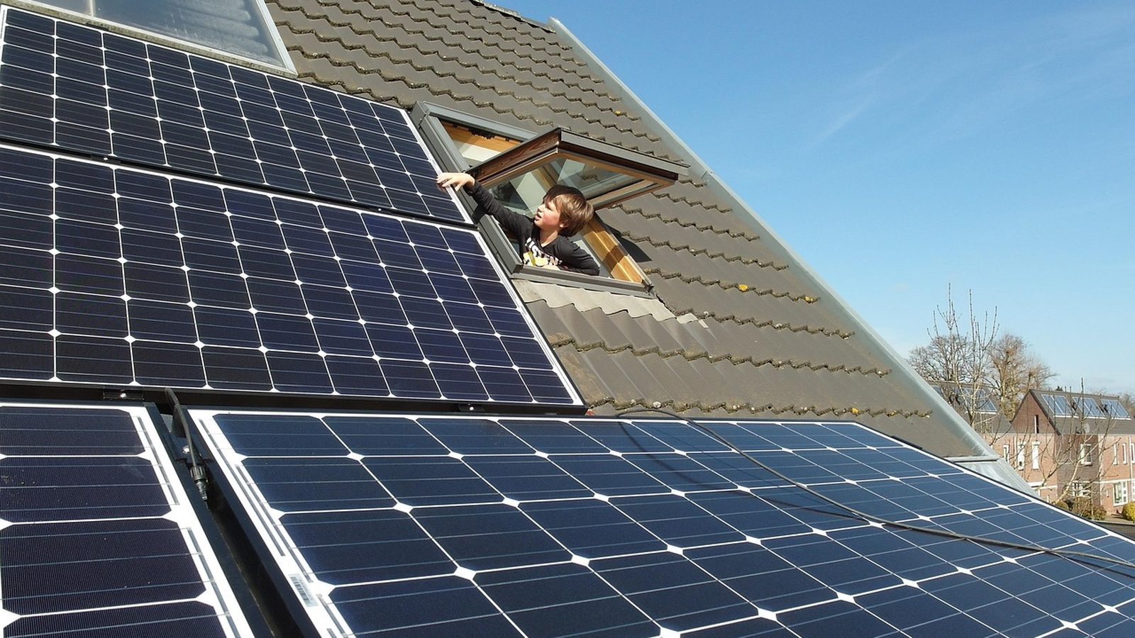 Rooftop solar panels catching afternoon light