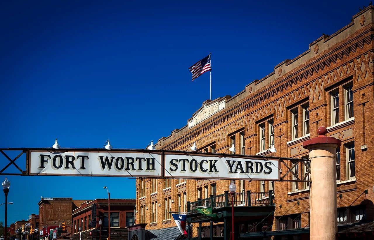 Fort Worth Stockyards entrance and Texas flag
