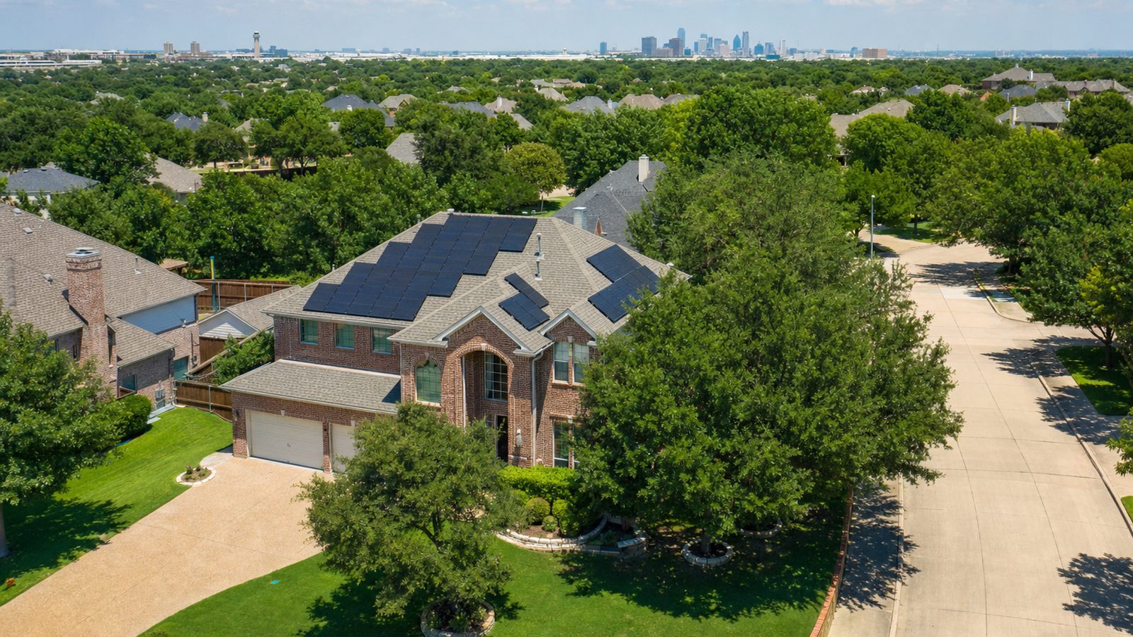 Rooftop solar panels on a single family home in North Texas under a clear sky