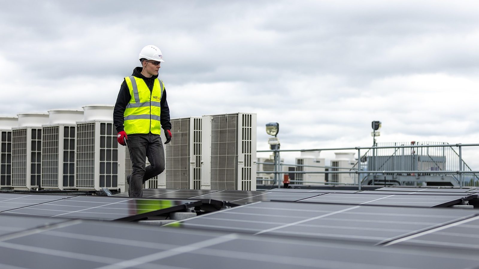 Technicians working on a residential rooftop solar array