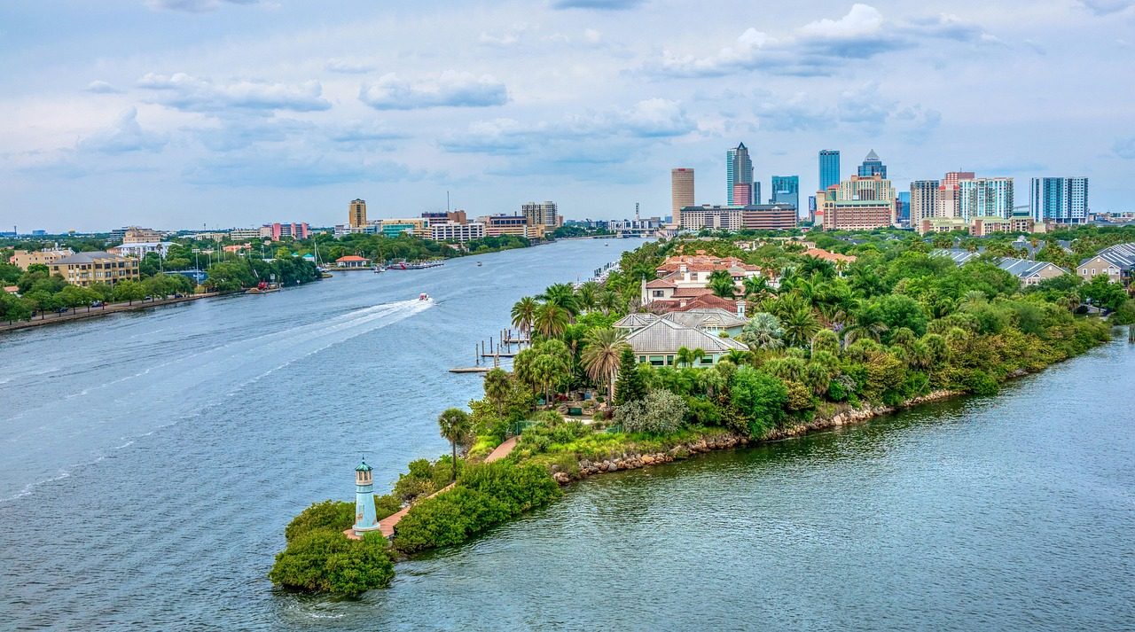 Tampa Bay skyline, waterfront buildings and a lighthouse under a blue sky