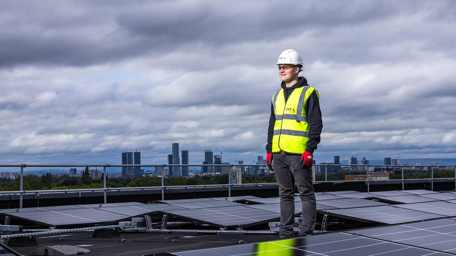 Solar installer working on a rooftop panel array